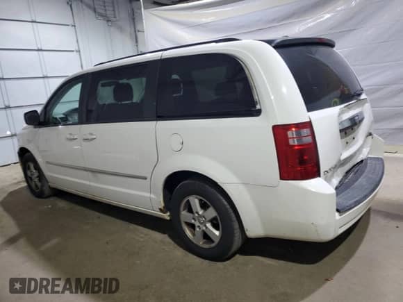 2010 Dodge Grand Caravan SXT z VIN 2D4RN5D17AR499253, wystawiony jako Copart lot #69954035 z przebiegiem 153 984 mil mil oraz Szkoda całkowita • Salvage title. Historia ofert i sprzedaży dostępna na DreamBid. Obrazek 2.