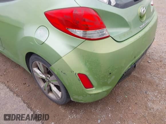 2012 Hyundai Veloster w/Gray Int z VIN KMHTC6AD6CU052668, wystawiony jako IAAI lot #43165096 z przebiegiem 156 135 mil mil oraz . Historia ofert i sprzedaży dostępna na DreamBid. Obrazek 6.