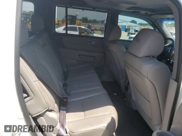 2015 Honda Pilot Touring z VIN 5FNYF3H97FB026644, wystawiony jako Copart lot #67012865 z przebiegiem 163 028 mil mil oraz Szkoda całkowita • Salvage title. Historia ofert i sprzedaży dostępna na DreamBid. Obrazek 11.