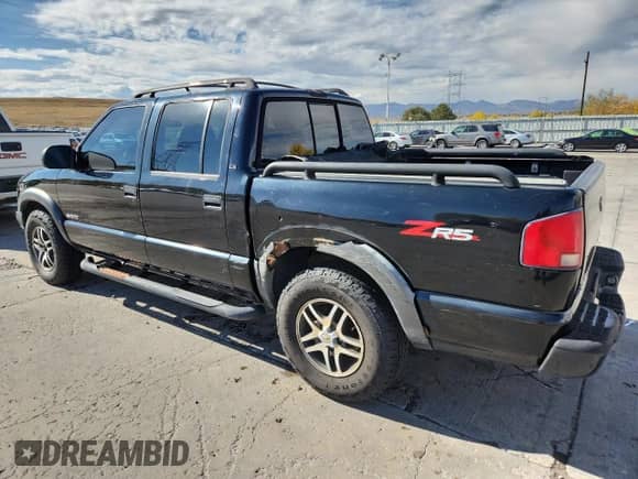 2003 Chevrolet S-10 LS with VIN 1GCDT13X53K180687, listed as a Copart auction lot 89549505 with 142,593 mi miles and Salvage title. Bid and sale history available at DreamBid. Image 2.