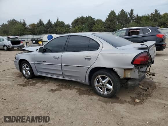 2000 Pontiac Grand Am GT z VIN 1G2NW52E5YC550660, wystawiony jako Copart lot #81565595 z przebiegiem 162 966 mil mil oraz Szkoda całkowita • Salvage title. Historia ofert i sprzedaży dostępna na DreamBid. Obrazek 2.
