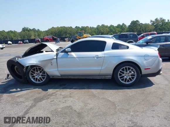 2012 Ford Mustang V6 with VIN 1ZVBP8AM7C5220275, listed as a IAAI auction lot 43152834 with 211,238 mi miles and . Bid and sale history available at DreamBid. Image 14.