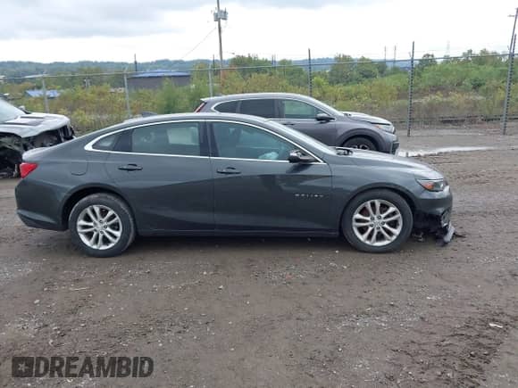 2018 Chevrolet Malibu LT z VIN 1G1ZD5ST6JF107433, wystawiony jako IAAI lot #43281943 z przebiegiem 59 802 mil mil oraz . Historia ofert i sprzedaży dostępna na DreamBid. Obrazek 13.