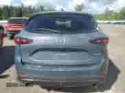 2023 Mazda CX-5 S Carbon Edition z VIN JM3KFBCM1P0249281, wystawiony jako Copart lot #70537745 z przebiegiem 22 623 mil mil oraz Szkoda całkowita • Salvage title. Historia ofert i sprzedaży dostępna na DreamBid. Obrazek 6.