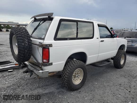 1991 Chevrolet Blazer с VIN 1GNCT18Z5M8105497, выставлен на аукционе Copart как лот 65277335 с пробегом 156 219 миль миль и Списание • Salvage title. История ставок и продаж доступна на DreamBid. Изображение 3.