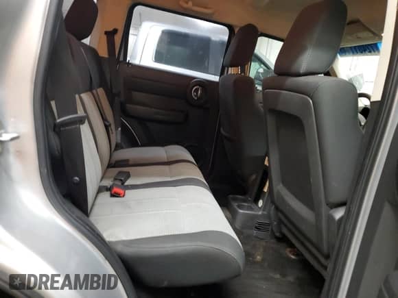 2009 Dodge Nitro SE z VIN 1D8GT28K69W527432, wystawiony jako Copart lot #72401114 z przebiegiem 108 070 mil mil oraz Szkoda całkowita • Salvage title. Historia ofert i sprzedaży dostępna na DreamBid. Obrazek 11.