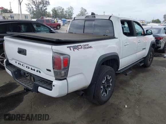 2021 Toyota Tacoma SR5 with VIN 5TFAZ5CN4MX111100, listed as a IAAI auction lot 42570230 with 54,460 mi miles and . Bid and sale history available at DreamBid. Image 4.