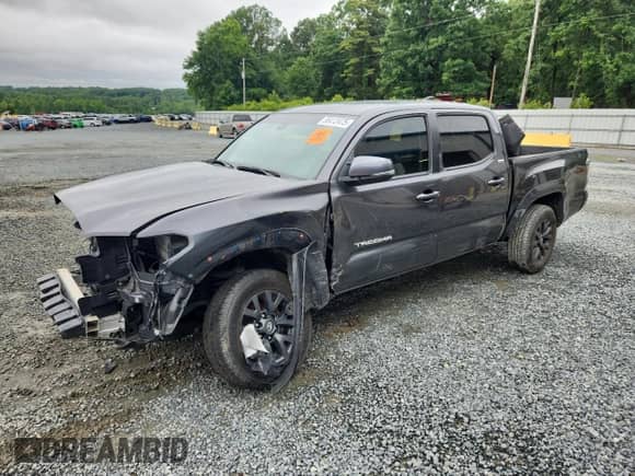2022 Toyota Tacoma SR5 with VIN 3TMAZ5CN6NM169121, listed as a Copart auction lot 58412475 with 83,911 mi miles and Salvage title. Bid and sale history available at DreamBid. Image 1.