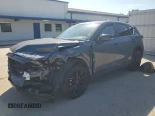 2024 Mazda CX-5 S Carbon Edition z VIN JM3KFBCLXR0513754, wystawiony jako Copart lot #84480635 z przebiegiem Nie podano mil oraz Czysty tytuł • Clean title. Historia ofert i sprzedaży dostępna na DreamBid. Obrazek 1.