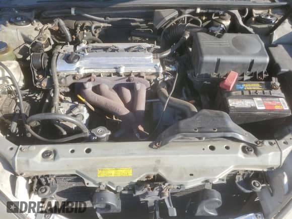 2002 Toyota Camry LE z VIN 4T1BE30K62U613616, wystawiony jako Copart lot #81403365 z przebiegiem 174 551 mil mil oraz Szkoda całkowita • Salvage title. Historia ofert i sprzedaży dostępna na DreamBid. Obrazek 11.