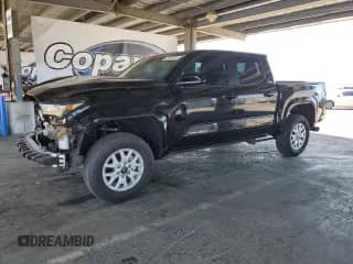2024 Toyota Tacoma SR5 with VIN 3TMKB5FN9RM023449, listed as a Copart auction lot 67866095 with 5,550 mi miles and Salvage title. Bid and sale history available at DreamBid. Image 1.