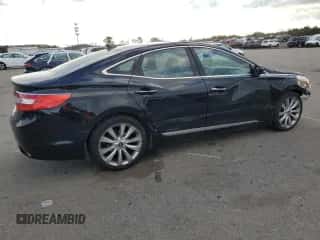 2013 Hyundai Azera с VIN KMHFH4JG3DA221836, выставлен на аукционе Copart как лот 83226124 с пробегом 178 484 миль миль и Списание • Salvage title. История ставок и продаж доступна на DreamBid. Изображение 3.