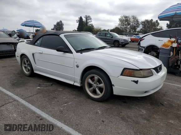 2004 Ford Mustang Deluxe с VIN 1FAFP44454F123067, выставлен на аукционе Copart как лот 86784474 с пробегом 161 541 миль миль и Списание • Salvage title. История ставок и продаж доступна на DreamBid. Изображение 4.