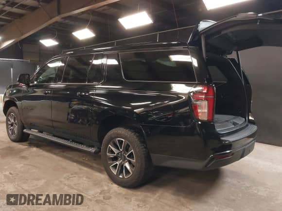 2021 Chevrolet Suburban Z71 with VIN 1GNSKDKD3MR140935, listed as a IAAI auction lot 42345178 with 52,370 mi miles and . Bid and sale history available at DreamBid. Image 3.