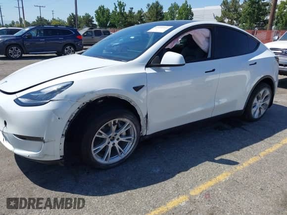 2023 Tesla Model Y Long Range z VIN 7SAYGDEE9PA081036, wystawiony jako IAAI lot #43151161 z przebiegiem 49 637 mil mil oraz . Historia ofert i sprzedaży dostępna na DreamBid. Obrazek 2.