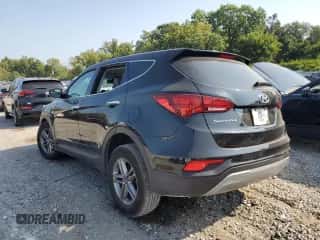 2018 Hyundai Santa Fe 2.4L z VIN 5NMZT3LB1JH070945, wystawiony jako Copart lot #80117525 z przebiegiem 141 580 mil mil oraz Szkoda całkowita • Salvage title. Historia ofert i sprzedaży dostępna na DreamBid. Obrazek 2.