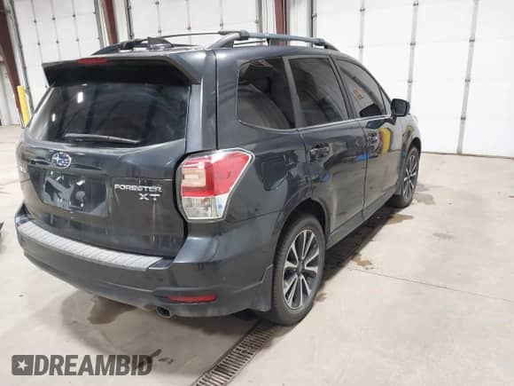 2018 Subaru Forester Premium with VIN JF2SJGEC2JH604459, listed as a IAAI auction lot 42514080 with 127,218 mi miles and . Bid and sale history available at DreamBid. Image 4.