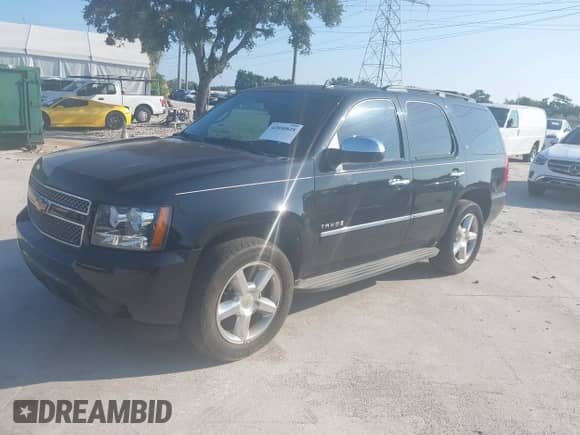 2009 Chevrolet Tahoe LTZ with VIN 1GNFC33089R297033, listed as a IAAI auction lot 42850828 with 310,614 mi miles and . Bid and sale history available at DreamBid. Image 17.