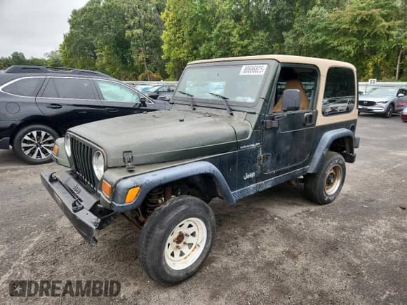 1997 Jeep Wrangler SE with VIN 1J4FY29P3VP474693, listed as a Copart auction lot 80686825 with 206,408 mi miles and Salvage title. Bid and sale history available at DreamBid. Image 1.