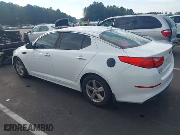 2015 Kia Optima LX z VIN 5XXGM4A71FG379247, wystawiony jako IAAI lot #43315720 z przebiegiem 262 464 mil mil oraz . Historia ofert i sprzedaży dostępna na DreamBid. Obrazek 3.