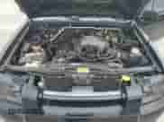 2004 Nissan Frontier XE z VIN 1N6ED29YX4C448276, wystawiony jako Copart lot #58335265 z przebiegiem 153 094 mil mil oraz Szkoda całkowita • Salvage title. Historia ofert i sprzedaży dostępna na DreamBid. Obrazek 11.