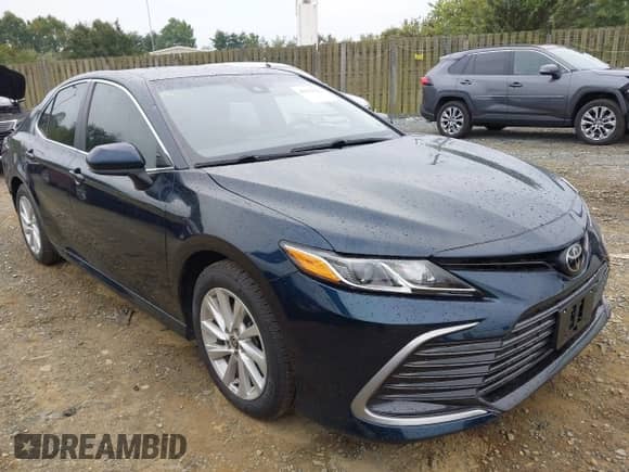2021 Toyota Camry LE with VIN 4T1C11AK8MU548158, listed as a IAAI auction lot 43333222 with 34,824 mi miles and . Bid and sale history available at DreamBid. Image 1.