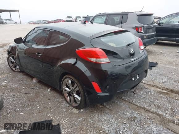 2014 Hyundai Veloster with VIN KMHTC6AD6EU182596, listed as a IAAI auction lot 41498382 with 99,376 mi miles and . Bid and sale history available at DreamBid. Image 14.