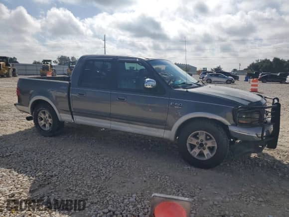 2002 Ford F-150 XLT с VIN 1FTRW07L42KE28490, выставлен на аукционе Copart как лот 90126215 с пробегом 289 777 миль миль и Списание • Salvage title. История ставок и продаж доступна на DreamBid. Изображение 4.
