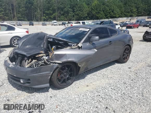 2004 Hyundai Tiburon GT с VIN KMHHN65F64U134817, выставлен на аукционе Copart как лот 66358955 с пробегом Не указан миль и Списание • Salvage title. История ставок и продаж доступна на DreamBid. Изображение 1.