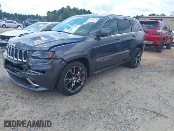 2014 Jeep Grand Cherokee SRT-8 with VIN 1C4RJFDJ1EC400567, listed as a IAAI auction lot 43222133 with 127,427 mi miles and . Bid and sale history available at DreamBid. Image 2.