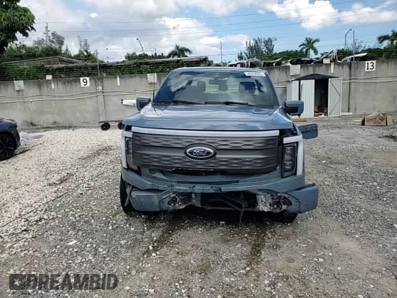 2023 Ford F-150 Lightning Pro with VIN 1FTVW1EV9PWG26295, listed as a Copart auction lot 80298305 with 43,492 mi miles and Salvage title. Bid and sale history available at DreamBid. Image 13.