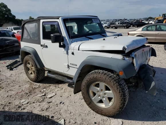 2012 Jeep Wrangler Sport with VIN 1C4AJWAG5CL220348, listed as a Copart auction lot 69854545 with 124,454 mi miles and Salvage title. Bid and sale history available at DreamBid. Image 4.