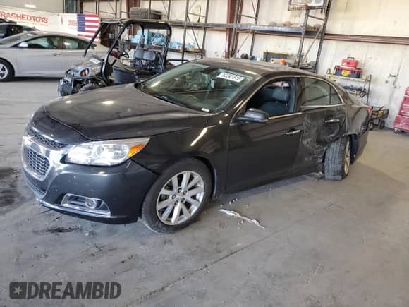 2015 Chevrolet Malibu LTZ with VIN 1G11F5SL2FF285001, listed as a Copart auction lot 82241815 with 121,715 mi miles and Salvage title. Bid and sale history available at DreamBid. Image 1.