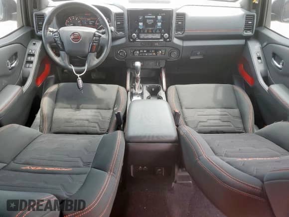 2023 Nissan Frontier Pro-4X with VIN 1N6ED1EKXPN668554, listed as a Copart auction lot 68050005 with 28,401 mi miles and Salvage title. Bid and sale history available at DreamBid. Image 8.