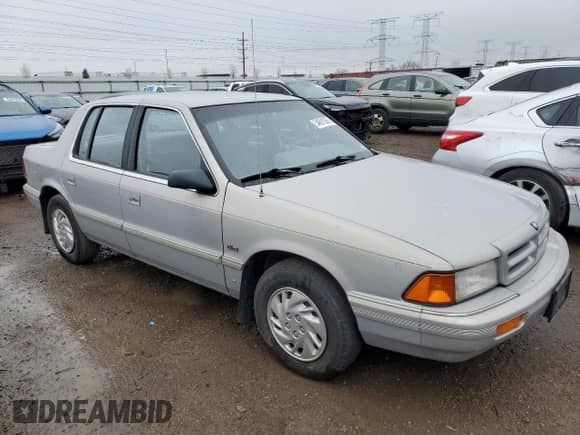 1993 Dodge Spirit with VIN 3B3XA4632PT520185, listed as a Copart auction lot 54891565 with 125,574 mi miles and Salvage title. Bid and sale history available at DreamBid. Image 4.