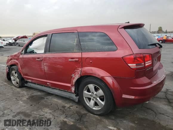 2009 Dodge Journey SXT with VIN 3D4GG57V89T215203, listed as a Copart auction lot 71056615 with 223,065 mi miles and Salvage title. Bid and sale history available at DreamBid. Image 2.