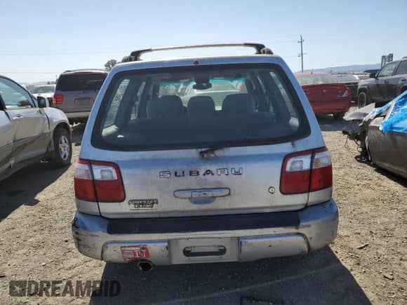 2002 Subaru Forester S with VIN JF1SF65612H743803, listed as a Copart auction lot 58748725 with 67,381 mi miles and Clean title. Bid and sale history available at DreamBid. Image 6.