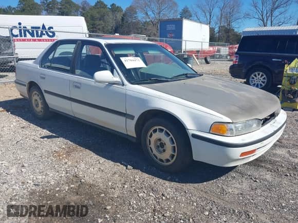 1992 Honda Accord LX z VIN JHMCB7659NC048944, wystawiony jako IAAI lot #41704471 z przebiegiem 253 535 mil mil oraz . Historia ofert i sprzedaży dostępna na DreamBid. Obrazek 1.