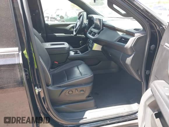 2023 Chevrolet Suburban Premier with VIN 1GNSCFKD1PR410564, listed as a IAAI auction lot 42247001 with 23,048 mi miles and . Bid and sale history available at DreamBid. Image 5.
