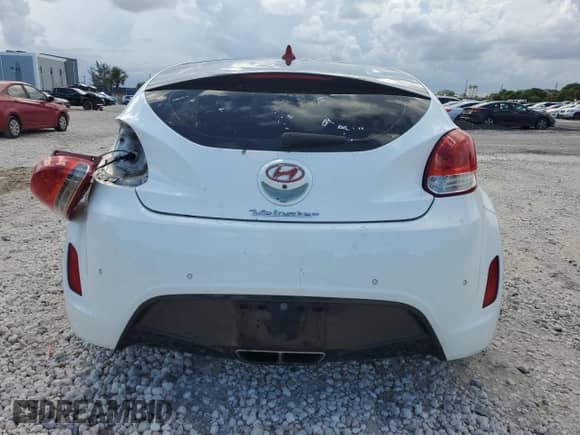 2014 Hyundai Veloster z VIN KMHTC6AD4EU194875, wystawiony jako Copart lot #84427235 z przebiegiem 127 813 mil mil oraz Szkoda całkowita • Salvage title. Historia ofert i sprzedaży dostępna na DreamBid. Obrazek 6.