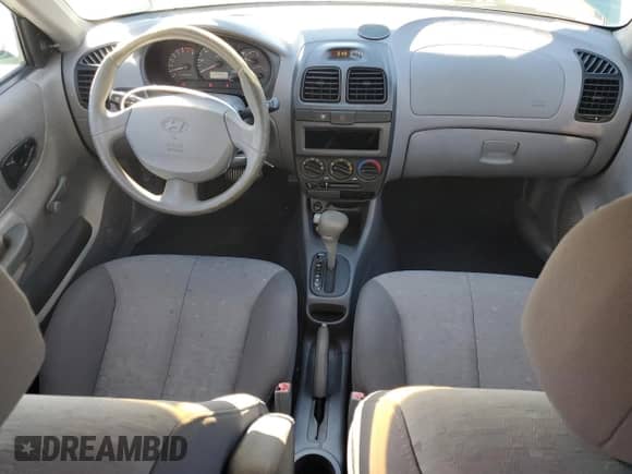 2003 Hyundai Accent GL с VIN KMHCG45C63U430403, выставлен на аукционе Copart как лот 86430724 с пробегом 74 200 миль миль и Списание • Salvage title. История ставок и продаж доступна на DreamBid. Изображение 8.