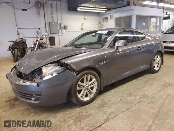 2007 Hyundai Tiburon GS with VIN KMHHM66D17U258112, listed as a Copart auction lot 60286334 with 117,735 mi miles and Salvage title. Bid and sale history available at DreamBid. Image 1.