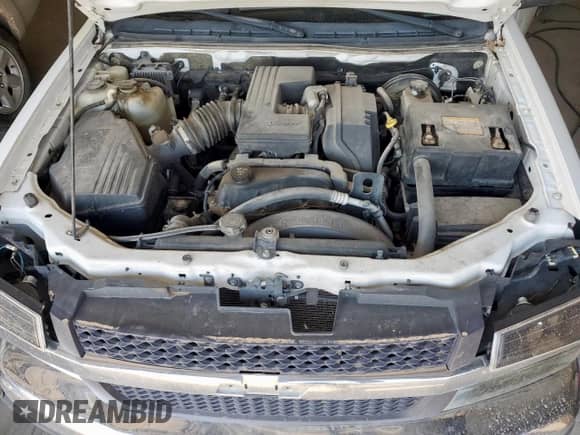 2006 Chevrolet Colorado Work Truck z VIN 1GCCS146468293066, wystawiony jako Copart lot #61366345 z przebiegiem 159 241 mil mil oraz Szkoda całkowita • Salvage title. Historia ofert i sprzedaży dostępna na DreamBid. Obrazek 11.