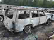 2000 Jeep Grand Cherokee with VIN 1J4FT28P6YL267968, listed as a Copart auction lot 63980434 with 309,367 mi miles and Clean title. Bid and sale history available at DreamBid. Image 3.