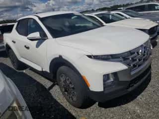 2022 Hyundai Santa Cruz SEL с VIN 5NTJBDAE6NH031751, выставлен на аукционе Copart как лот 74124684 с пробегом Не указан миль и На запчасти • Non repairable. История ставок и продаж доступна на DreamBid. Изображение 4.