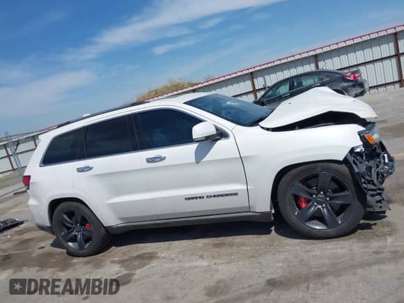2017 Jeep Grand Cherokee Summit with VIN 1C4RJFJT1HC772405, listed as a IAAI auction lot 42254264 with 69,757 mi miles and . Bid and sale history available at DreamBid. Image 14.