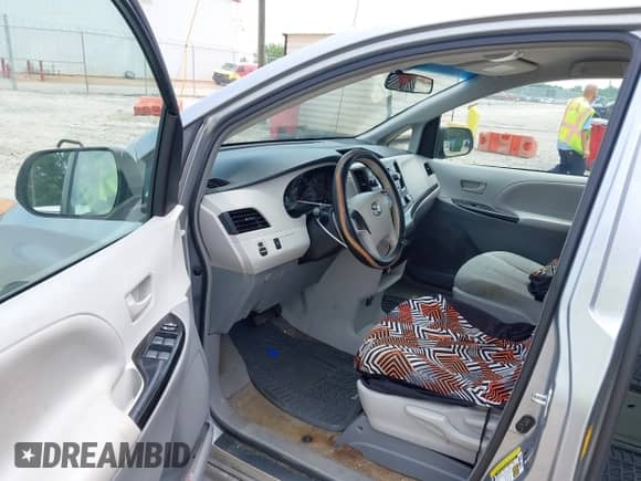 2014 Toyota Sienna L with VIN 5TDZK3DC5ES524062, listed as a IAAI auction lot 42601245 with 130,892 mi miles and . Bid and sale history available at DreamBid. Image 5.