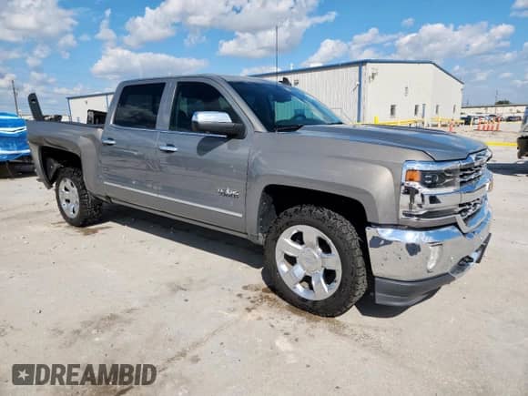 2017 Chevrolet Silverado 1500 LTZ with VIN 3GCPCSECXHG179093, listed as a Copart auction lot 84363995 with 153,438 mi miles and Salvage title. Bid and sale history available at DreamBid. Image 4.