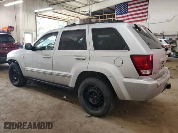 2009 Jeep Grand Cherokee Limited с VIN 1J8HR58P79C506842, выставлен на аукционе Copart как лот 81129595 с пробегом 155 295 миль миль и На запчасти • Non repairable. История ставок и продаж доступна на DreamBid. Изображение 2.