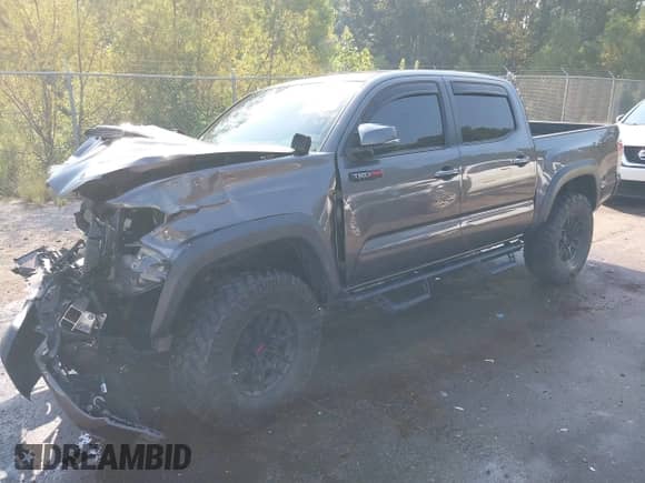 2020 Toyota Tacoma SR5 with VIN 5TFCZ5AN4LX237581, listed as a IAAI auction lot 43191708 with 126,946 mi miles and . Bid and sale history available at DreamBid. Image 2.